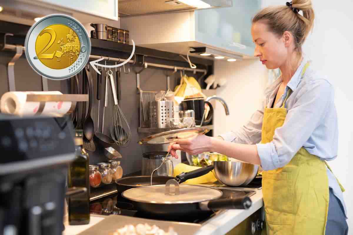 donna che prepara la cena ai fornelli